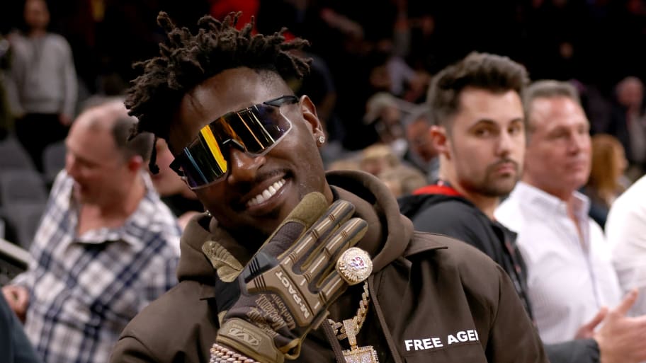 Former Tampa Bay Buccaneers wide receiver Antonio Brown poses for photographers after the game between the Atlanta Hawks and the LA Clippers at State Farm Arena. 