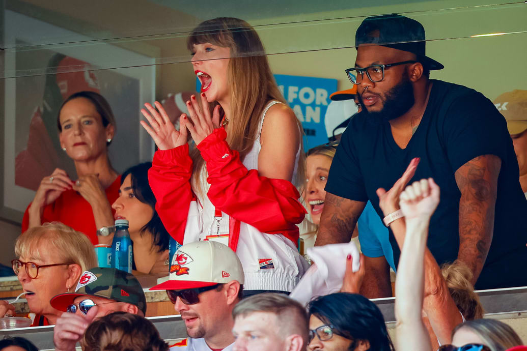 A photograph of Taylor Swift watching the first game she attended for the Chiefs.