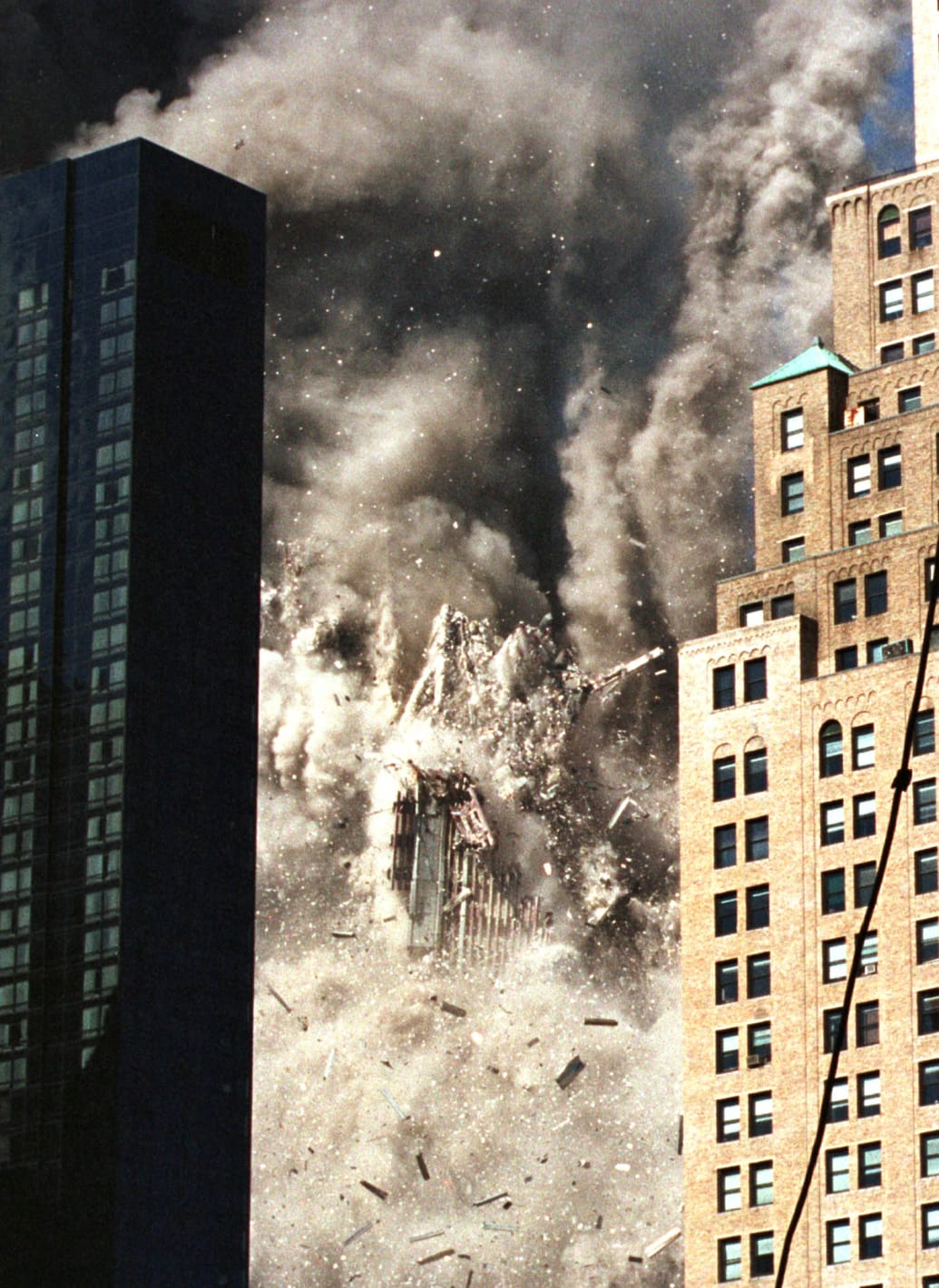 A photo Petra Beter took of one of the towers of the World Trade Center collapses after being struck by a hijacked commercial airplane on Sept. 11, 2001.