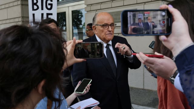 Former New York City Mayor Rudy Giuliani, an attorney for former President Donald Trump during challenges to the 2020 election results, exits U.S. District Court after attending a hearing in a defamation suit.