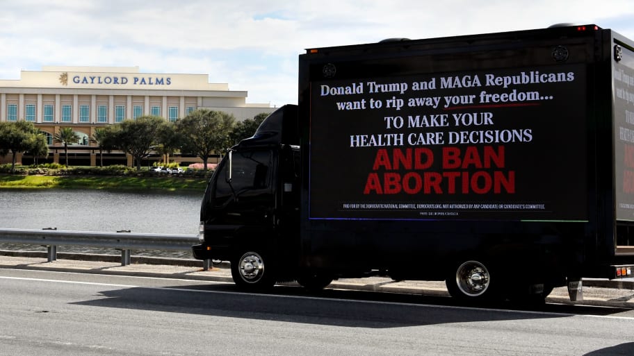 A mobile billboard sponsored by the DNC is seen outside the Florida Freedom Summit in November 2023 in Kissimmee, Florida. 