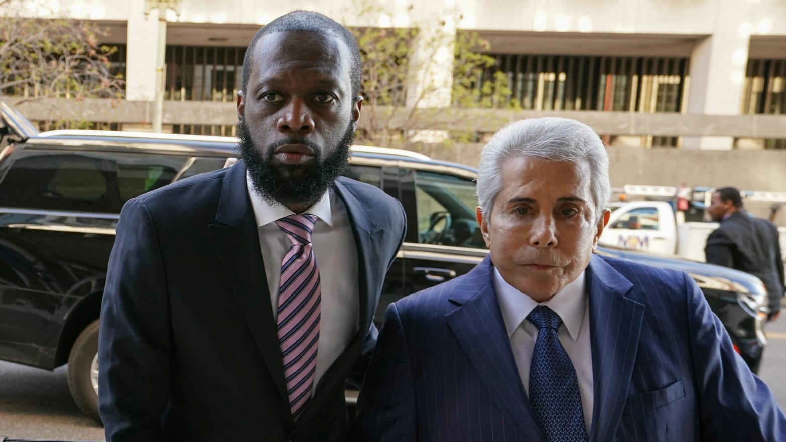 Grammy award-winning Fugees rapper Prakazrel (Pras) Michel, who is facing criminal charges in an alleged illegal lobbying campaign, arrives with his lawyer David Kenner for opening arguments in his trial at U.S. District Court