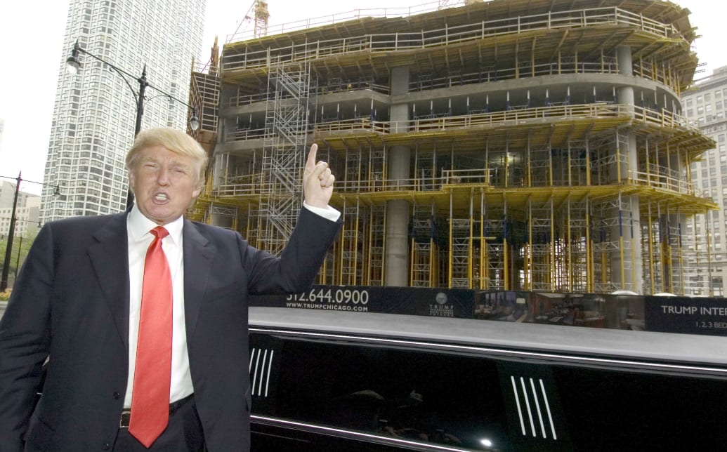 Donald Trump poses across the street from the job site of the Trump International Hotel and Tower Chicago after a news conference in Chicago May 10, 2006. 