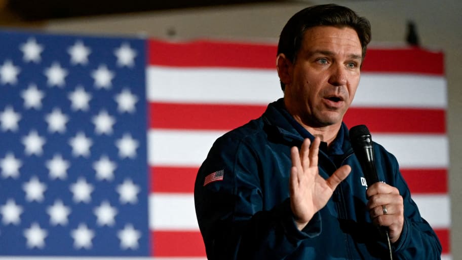 Republican presidential candidate and Florida Governor Ron DeSantis gestures as he speaks at a campaign event at The Thunderdome in Newton, Iowa