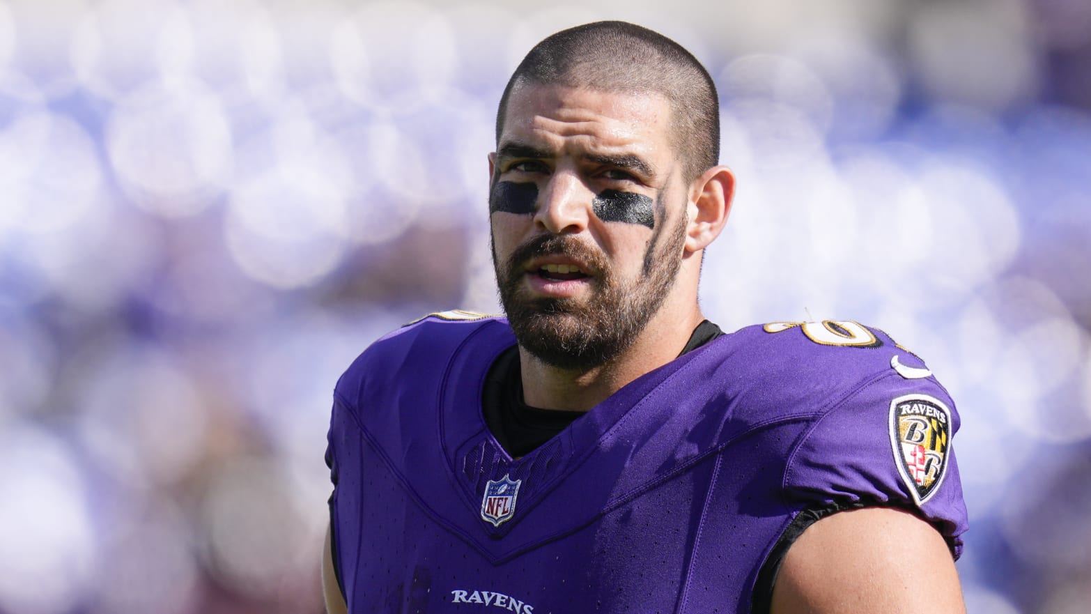 Mark Andrews, in uniform, stands on the sideline during an NFL game.