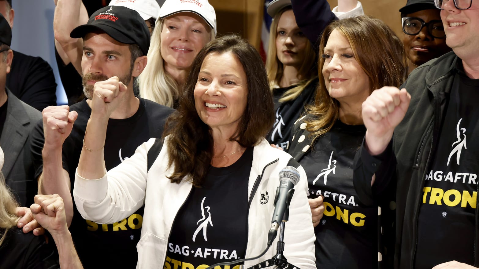 Photo of Fran Drescher with her fist in the air after she spoke at the SAG strike announcement