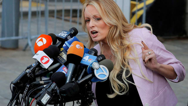 Adult-film actress Stephanie Clifford, also known as Stormy Daniels, speaks as she departs federal court in the Manhattan borough of New York City, New York, U.S., April 16, 2018. 