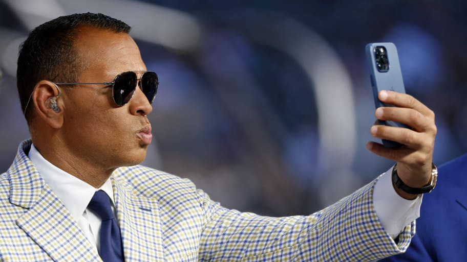 Alex Rodriguez making a duck face with his lips while taking a selfie.