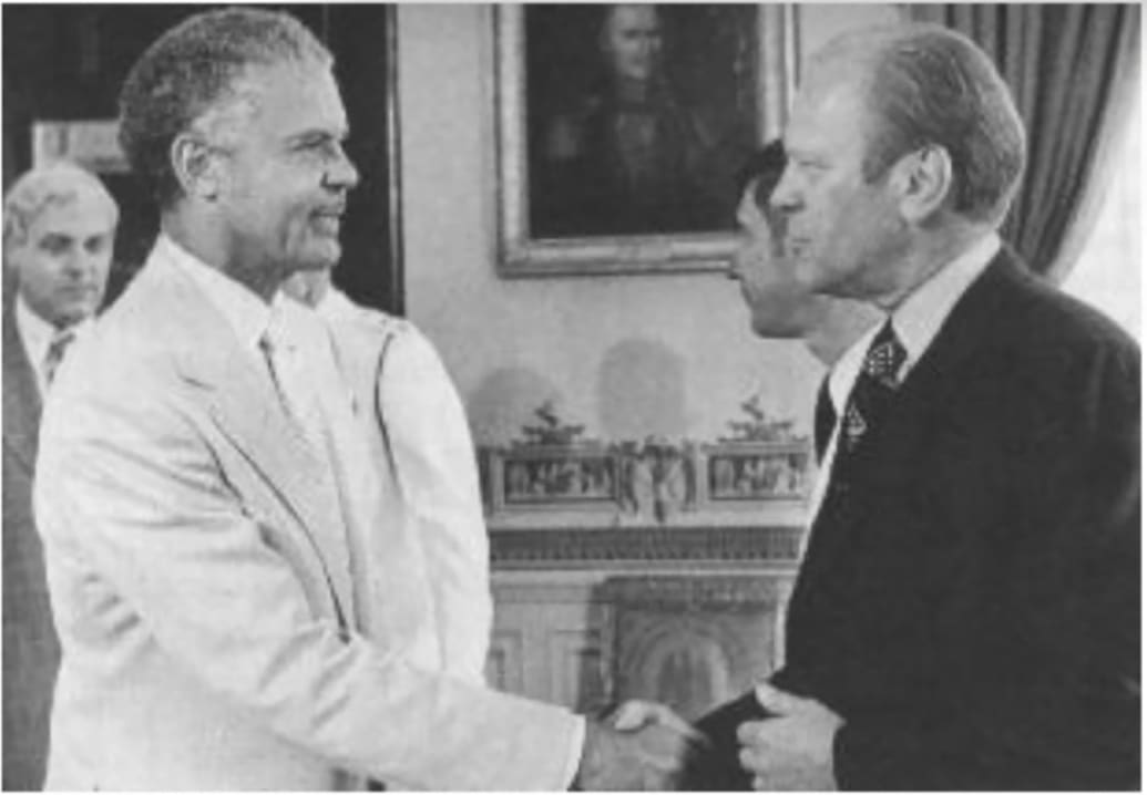 A picture of President Gerald Ford shaking hands with Benjamin Davis 