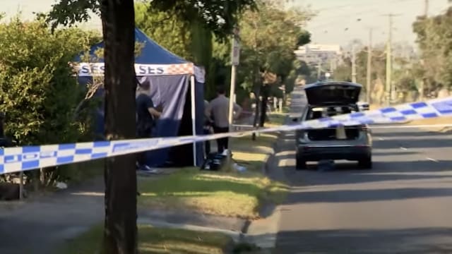 Police at the scene in Melbourne where a man’s body was found after falling from a hot air balloon. 