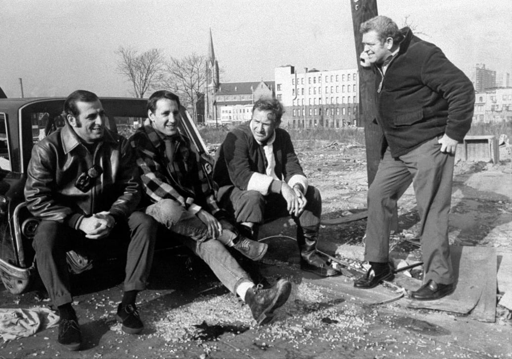 A photograph of Detective First Grade Sonny Grosso and Detective First Grade Eddie Egan with actors Roy Scheider and Gene Hackman, during filming of The French Connection.