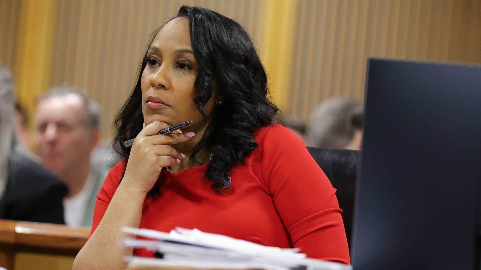 Fulton County District Attorney Fani Willis listens during the final arguments in her disqualification hearing at the Fulton County Courthouse in Atlanta, Georgia.