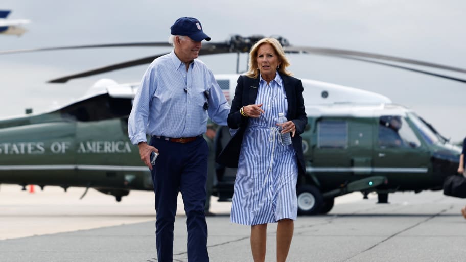 U.S. President Joe Biden and first lady Jill Biden walk to board Air Force One as they depart after touring Florida Hurricane Idalia storm destruction, in Gainesville, Florida