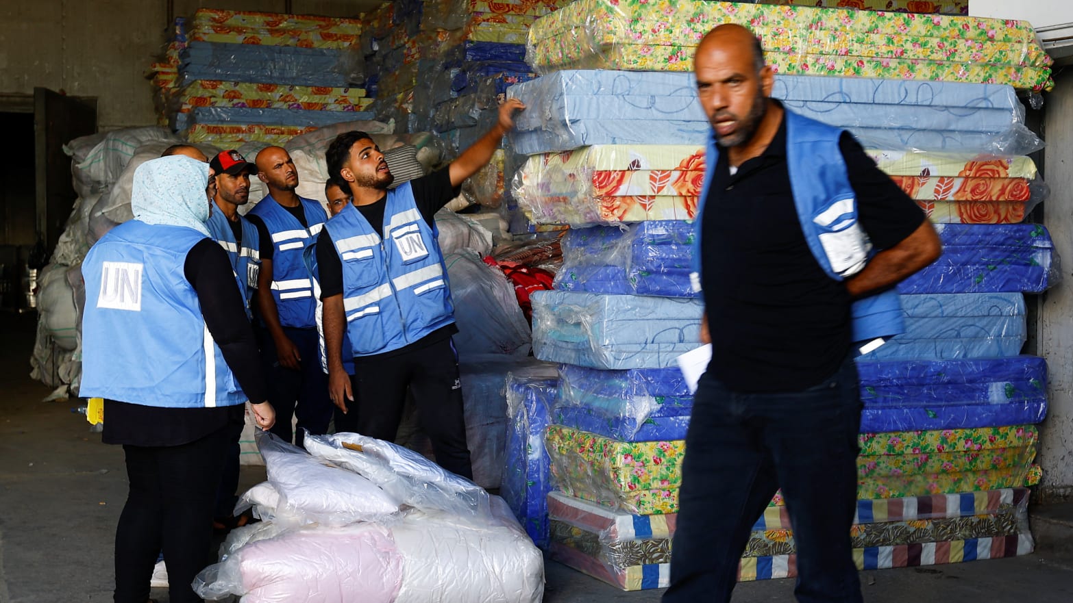 UNRWA workers sort aid to be delivered to Gazans.