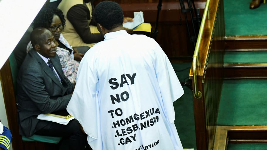 John Musira, a member of Parliament from Bubulo constituency, dressed in an anti-gay gown, attends the debate of the anti-homosexuality bill inside the chambers.