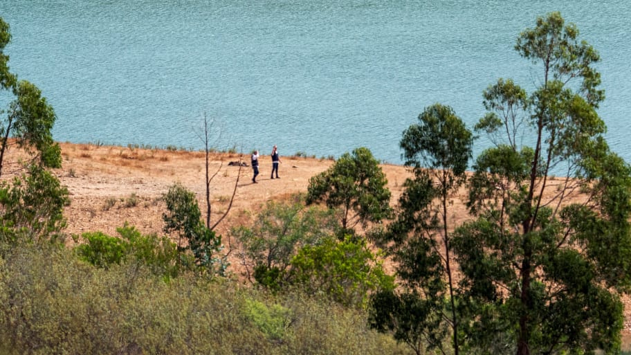 Officers of Portugal's investigative Judicial Police are seen at the site of a remote reservoir where a new search for the body of Madeleine McCann is set to take place, in Silves, Portugal, in this screen grab from a video, May 22, 2023. 