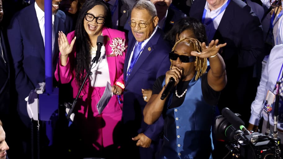 Rapper Lil Jon (R) performs with the Georgia delegation during the Ceremonial Roll Call of States on the second day of the Democratic National Convention at the United Center on August 20, 2024 in Chicago, Illinois. 