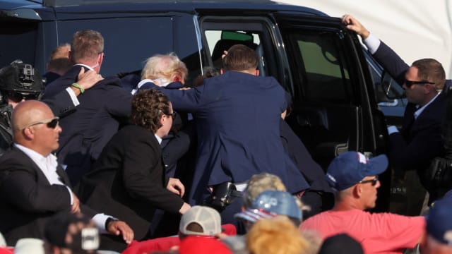 Republican presidential candidate and former U.S. President Donald Trump gets into a vehicle with the assistance of U.S. Secret Service personnel after assassination attempt