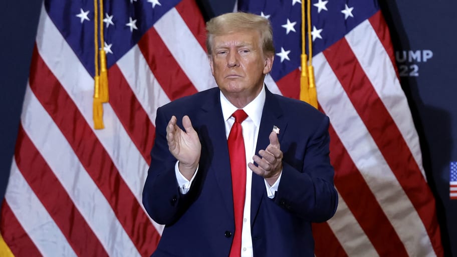 Donald Trump claps in Iowa.