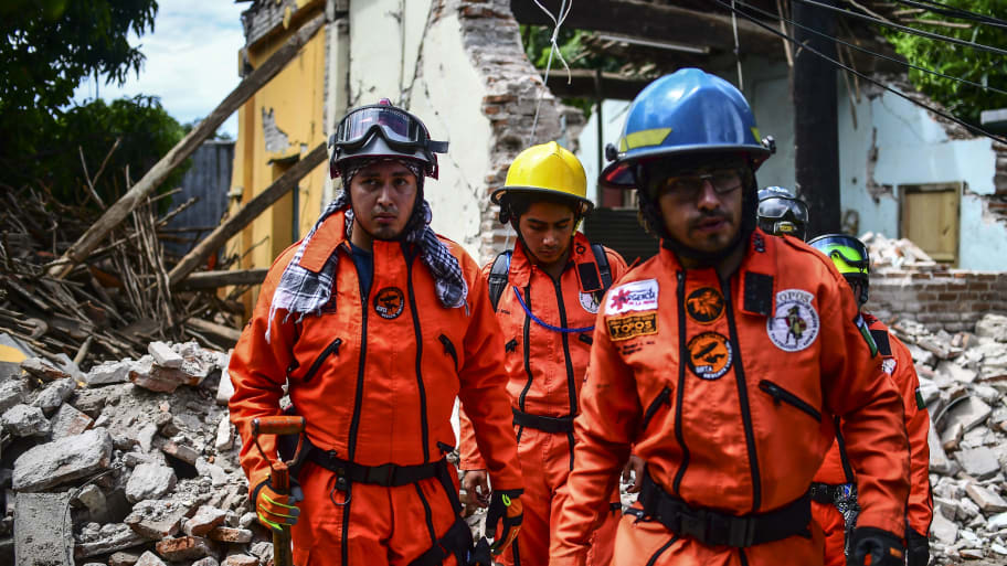 Rescuers search amid houses knocked down or severely damaged by Thursday night's 8.2-magnitude quake, in Juchitan, Oaxaca, Mexico