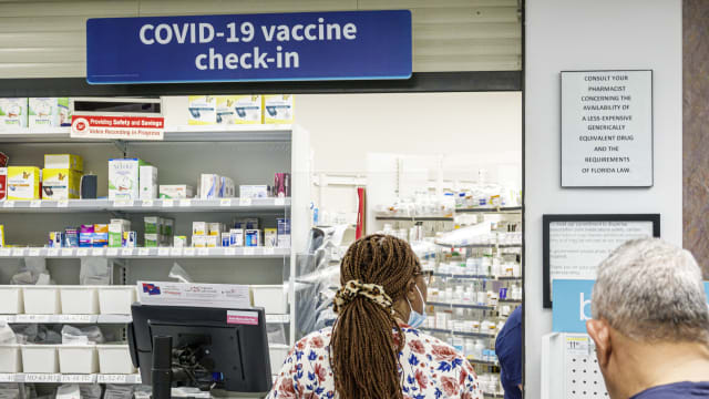 Miami Beach, Florida, Walgreens, Pharmacy and counter Covid-19 vaccine check-in sign.