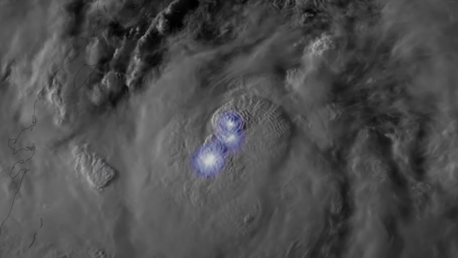 Lightning flashes in Tropical Storm Idalia as it is forecast to intensify into a hurricane before hitting Florida.