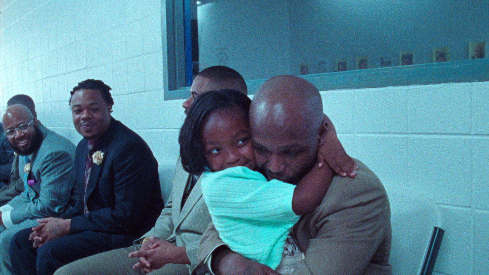 A still of a father and daughter hugging in the film 'Daughters'