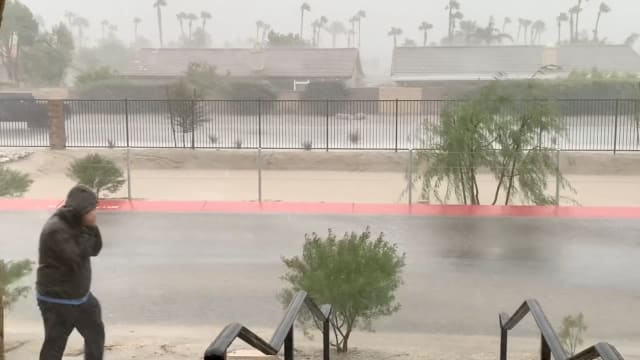 Strong winds and rain are seen from a residence as Tropical Storm Hilary approaches, in Cathedral City, California, U.S. August 20, 2023 in this screen grab obtained from social media video. 