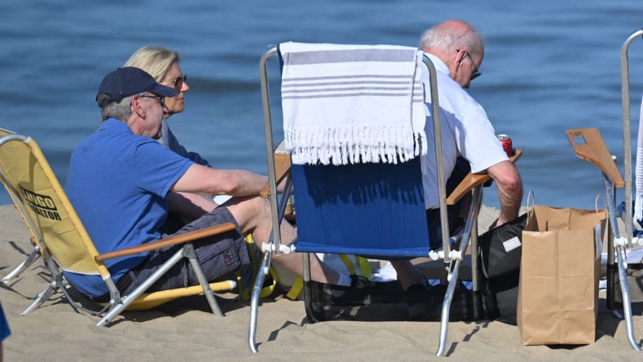 First Lady Jill Biden sits with US President Joe Biden on the beach in Rehoboth Beach, Delaware.