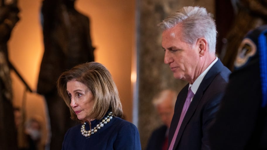 Nancy Pelosi and House Minority Leader Kevin McCarthy pause at the casket of Republican Representative from Alaska Don Young