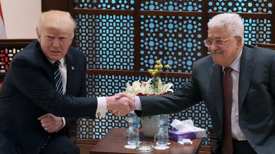 Donald Trump shakes hands with Palestinian leader Mahmud Abbas during a meeting at the presidential palace in the West Bank city of Bethlehem on May 23, 2017.