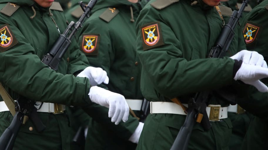 Russian service members take part in a military parade 