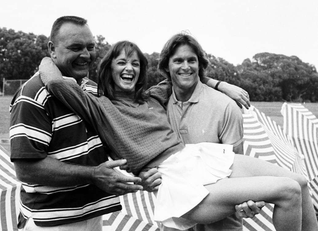 Olympian Bruce Jenner (R) poses with NFL player Dick Butkus and actress Pamela Sue Martin.