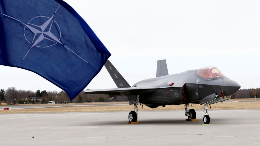 NATO flag flutters next to the U.S. Air Force F-35A Lightning II fighter in Amari air base, Estonia, April 25, 2017. 