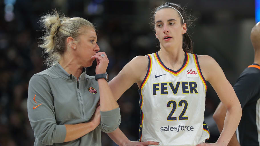 Indiana Fever head coach Christie Sides chats with Caitlin Clark #22.