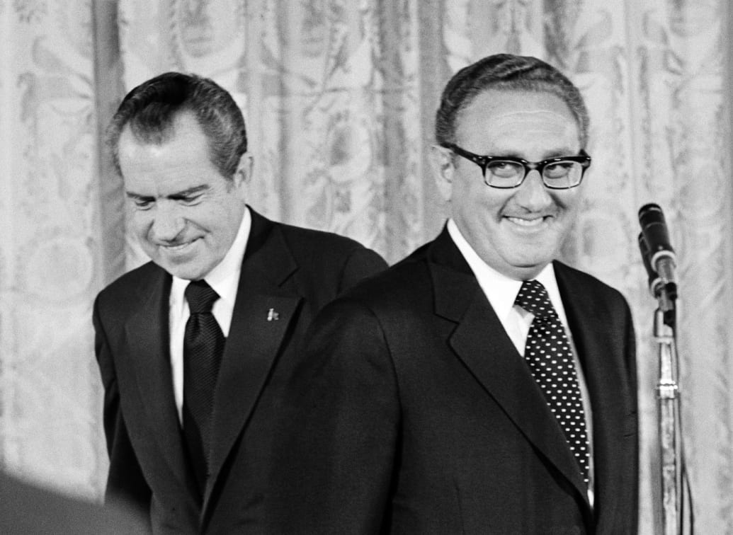 A photo including former U.S. President Richard Nixon and newly appointed Secretary of State Henry Kissinger