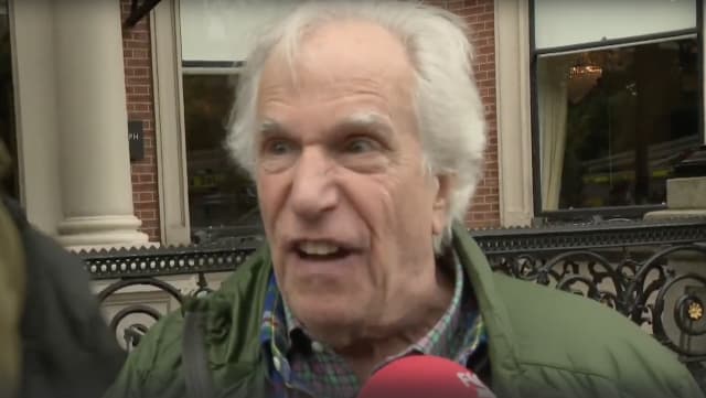 Henry Winkler speaks to the media after being evacuated from a hotel in Dublin, Ireland during a fire.