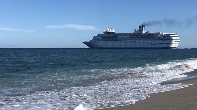A Margaritaville at Sea cruise ship leaving port. 