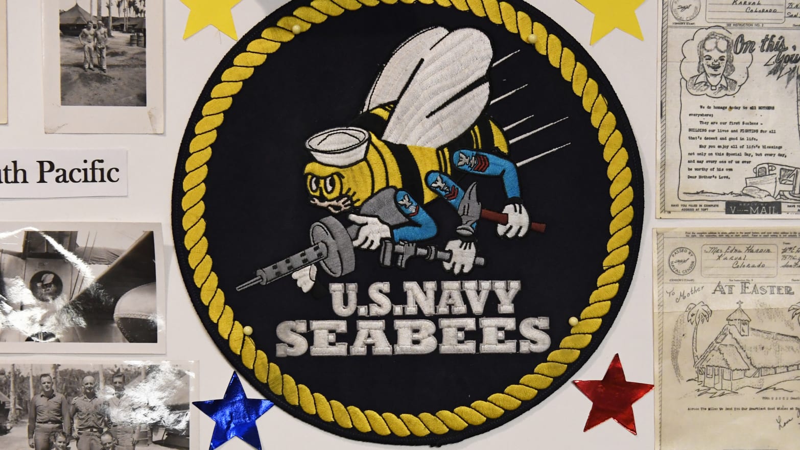 A photo of a U.S. Navy Seabees logo and associated ephemera.