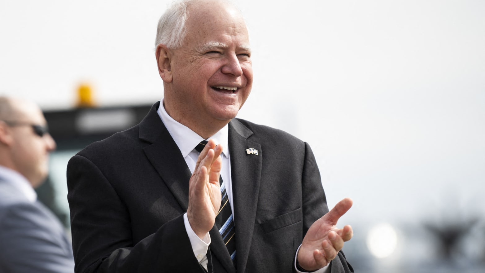 Minnesota Governor Tim Walz awaits the arrival of Vice President Kamala Harris at the Minneapolis-St. Paul International Airport on March 14, 2024. 