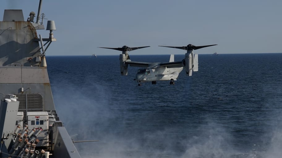 U.S. helicopter landing on the USS Mesa Verde ship.