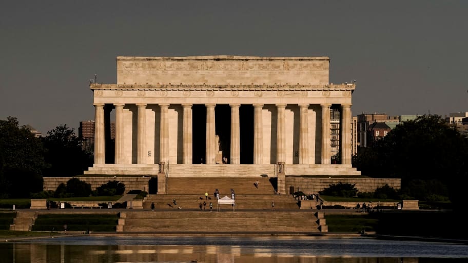 A view shows a reflection of the Lincoln Memorial in the Lincoln Memorial Reflecting Pool in early morning ahead of Memorial Day weekend in Washington, DC