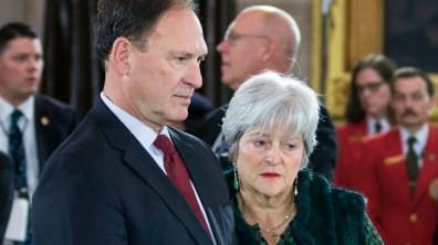 Martha-Ann Alito stands next to her husband at a funeral.