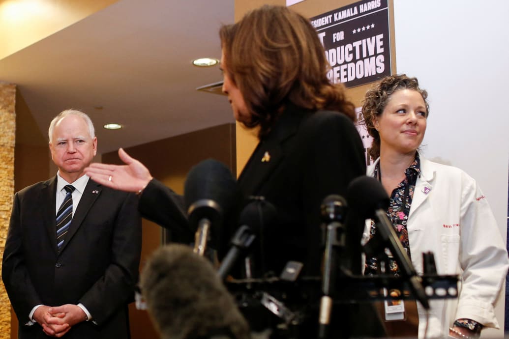 Vice President Kamala Harris speaks next to Minnesota Gov. Tim Walz during a visit to the St. Paul Health Center in St. Paul, Minnesota on March 14, 2024