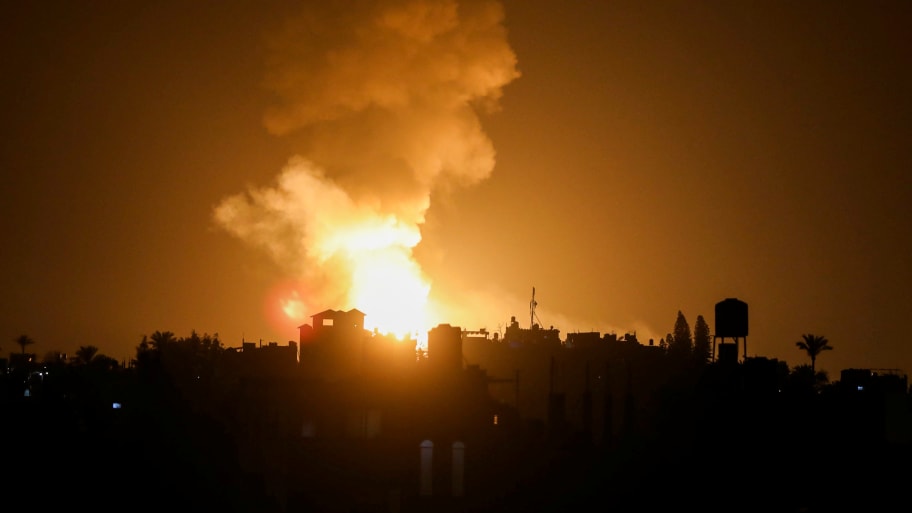 An explosion is seen following Israeli airstrikes in the southern Gaza strip May 9, 2023.