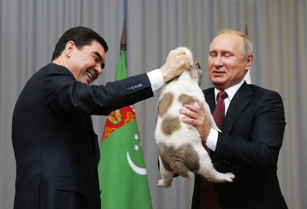 Turkmenistan's President Gurbanguly Berdimuhamedov presents a Turkmen shepherd dog, locally known as Alabai, to his Russian counterpart Vladimir Putin during a meeting in Sochi, Russia October 11, 2017. 