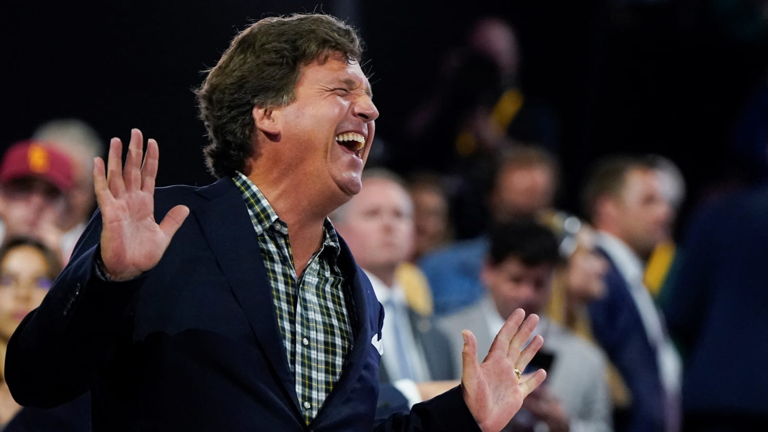 Tucker Carlson laughs during Day 1 of the Republican National Convention (RNC) at the Fiserv Forum in Milwaukee, Wisconsin, U.S., July 15, 2024. 