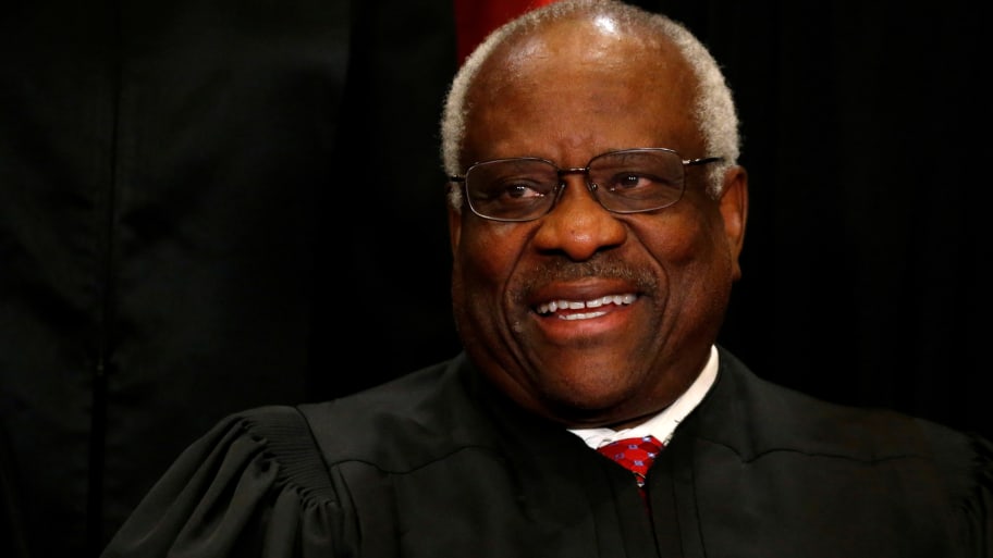U.S. Supreme Court Justice Clarence Thomas participates in taking a new "family photo" with his fellow justices at the Supreme Court building in Washington, D.C., U.S., June 1, 2017.