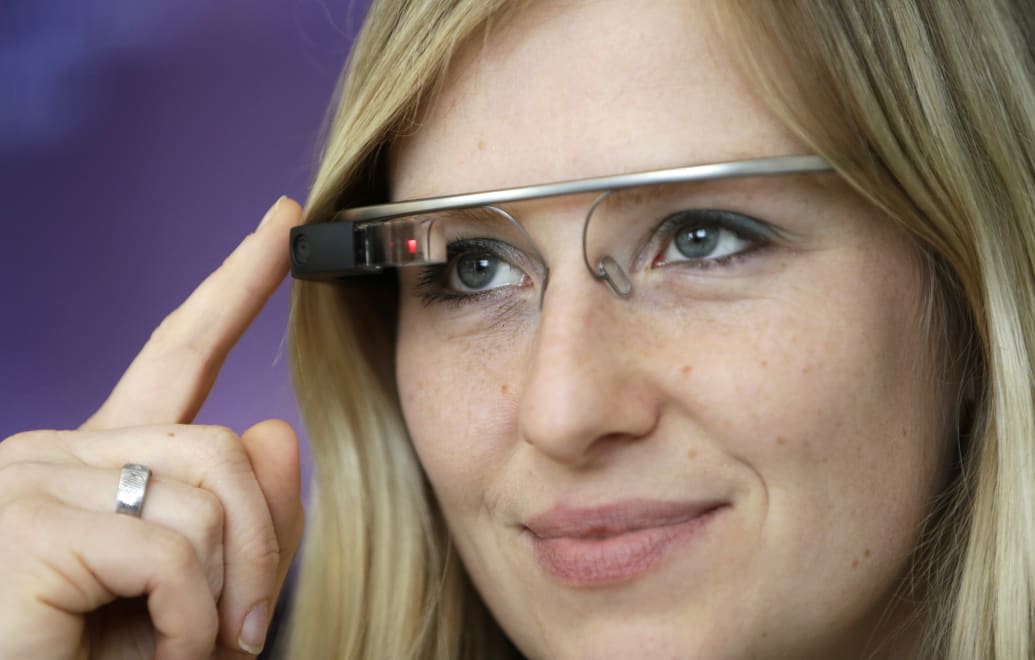 A woman wears Google glasses after a media presentation of a Google apartment in Prague May 15, 2014.