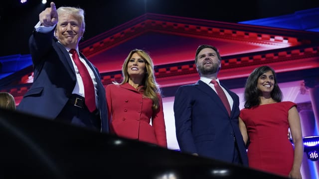 Republican presidential nominee and former U.S. President Donald Trump is joined on stage by wife Melania and Republican vice presidential nominee J.D. Vance and his wife Usha Chilukuri Vance at the Republican National Convention on July 18, 2024. 